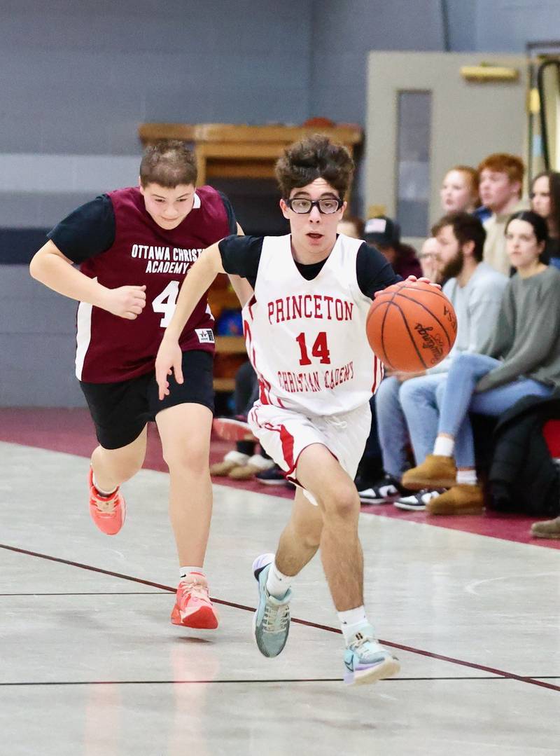 Santiago Slevin brings the ball upcourt for the Princeton Christian Academy's high school team in the second half of Tuesday's game at Howard Hoffman Memorial Gym against Ottawa Christian Academy. The Eagles won 57-42.