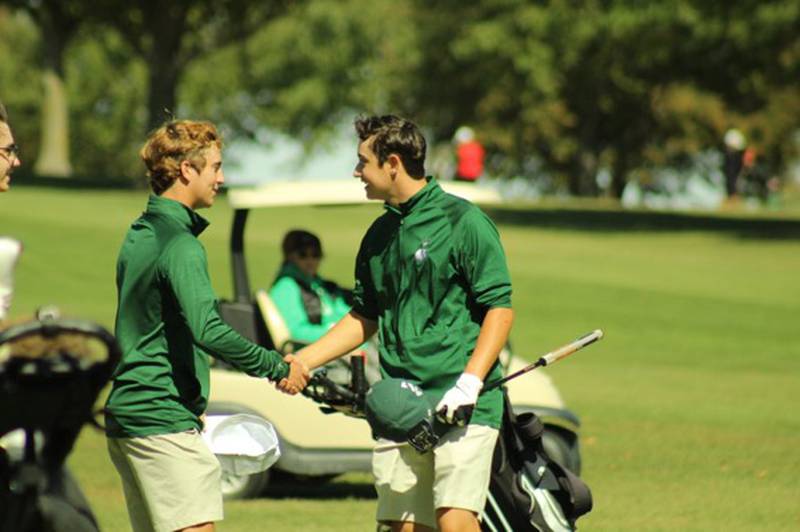 Brendan Pillion and Jake Delaney of St. Bede congratulate one another for qualifying for the golf sectionals.