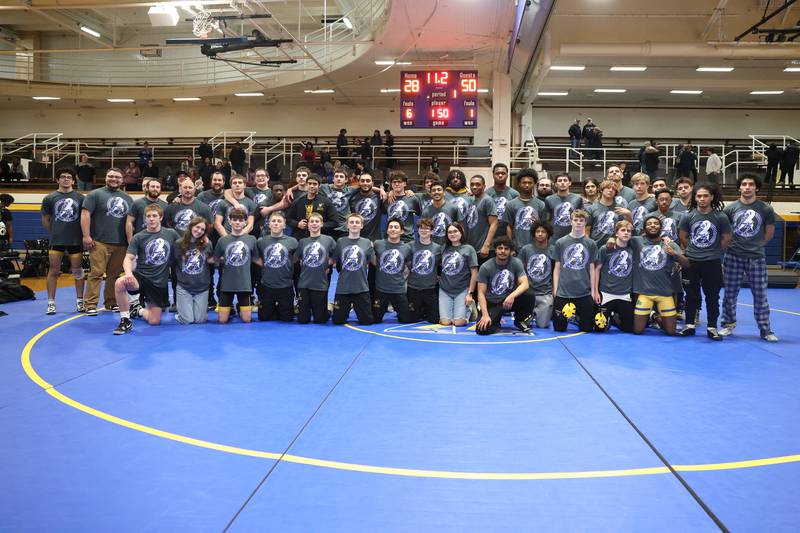 Joliet Central pose for a photo after their match against Joliet West on Friday, Jan 31, 2025.