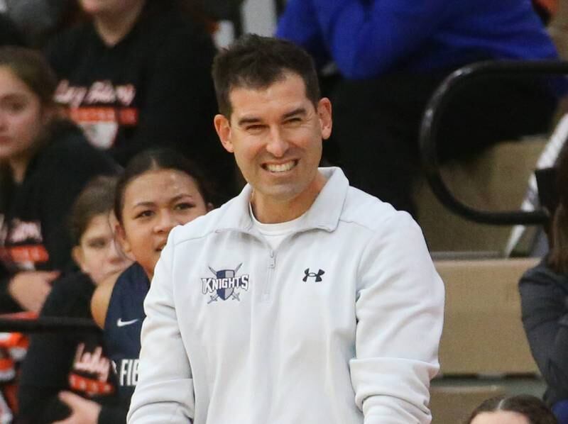 Fieldcrest's head girls basketball coach Nathan Ehrhardt smiles as he coaches his team against Marquette during the Integrated Seed Lady falcon Basketball Classic tournament on Monday, Nov. 13, 2023 at Flanagan High School.