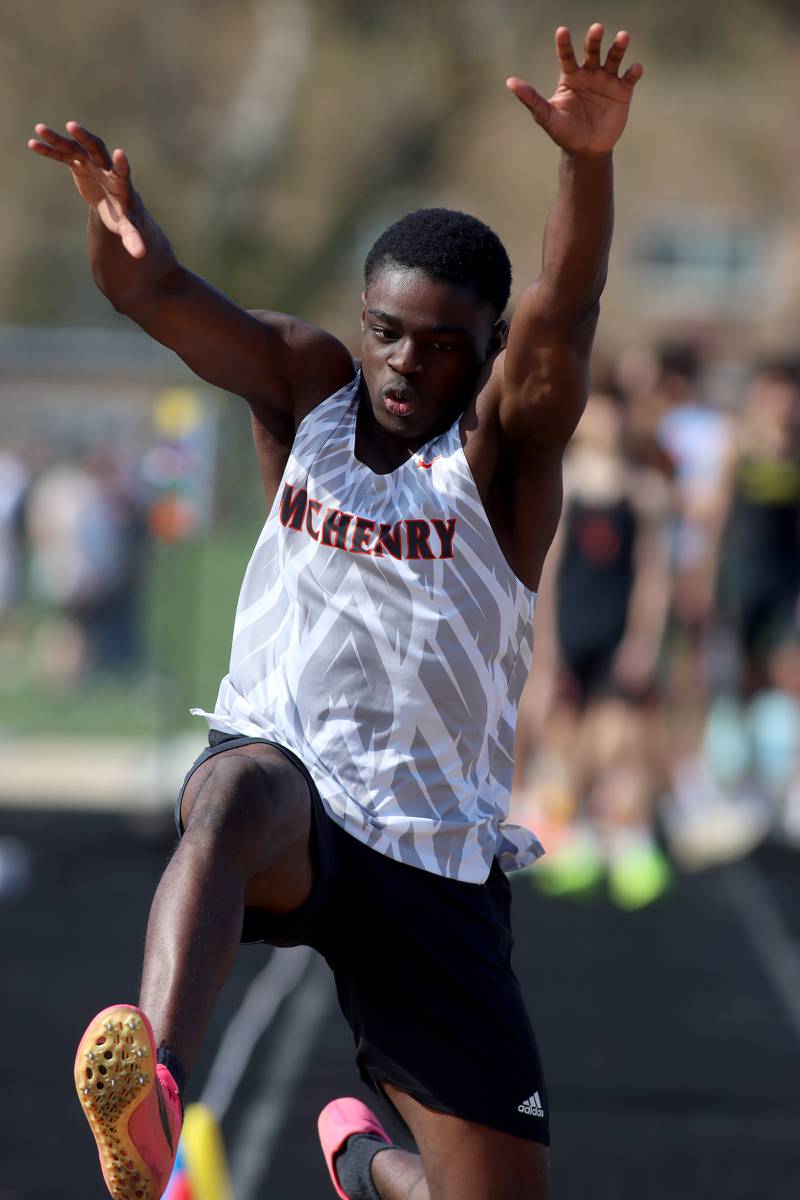 McHenry’s Ayomikun Bejide competes in the triple jump during the McHenry County Track and Field Meet at McCracken Field on Thursday, April 24, 2025, in McHenry