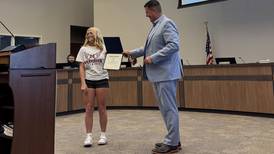 Morris congratulates 3-time IESA champion Caputo on track and field accomplishments