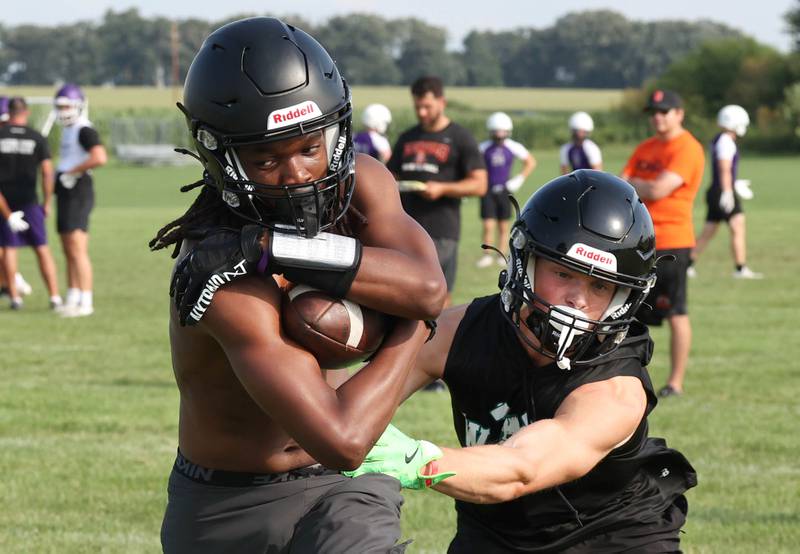 A DeKalb receiver makes a catch behind a Woodstock North defender Tuesday, July 16, 2024, in the Kaneland 7-on-7 at the school in Maple Park.