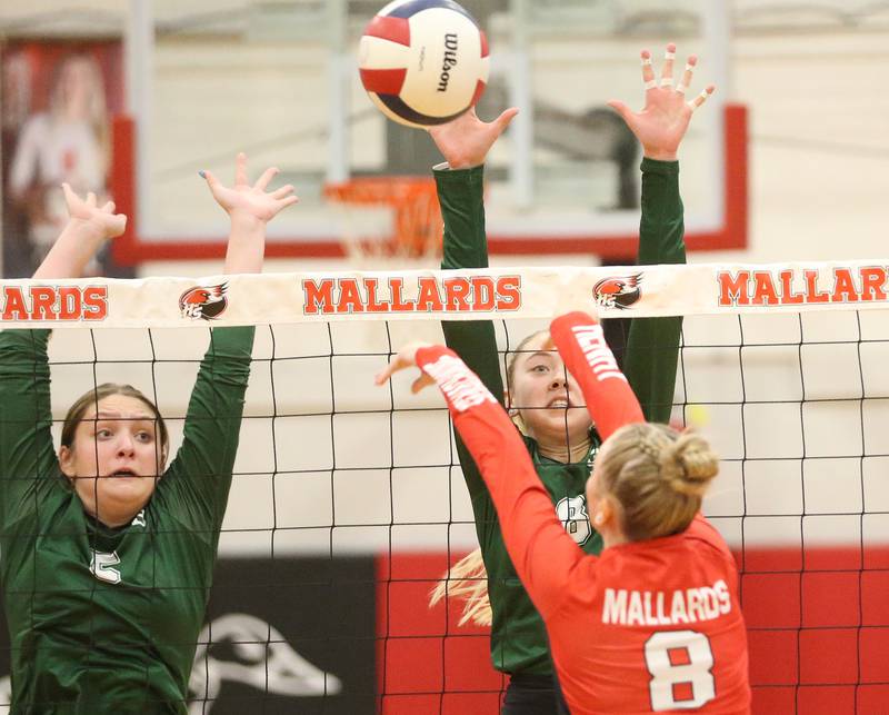 St. Bede's Nelle Potthoff reaches up to block a spike from Henry-Senachwine's Mazie Koll on Tuesday, Oct. 21, 2025 at Henry-Senachwine High School.