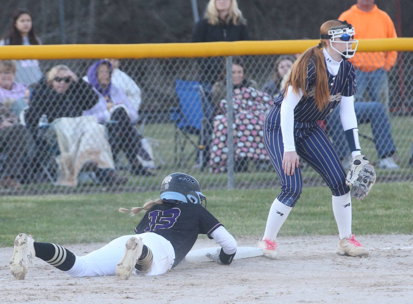 Serena's Brynley Glade dives safely into third base as Marquette's Ava Lieteritz waits for the throw on Wednesday, March 26, 2025 at Serena High School.
