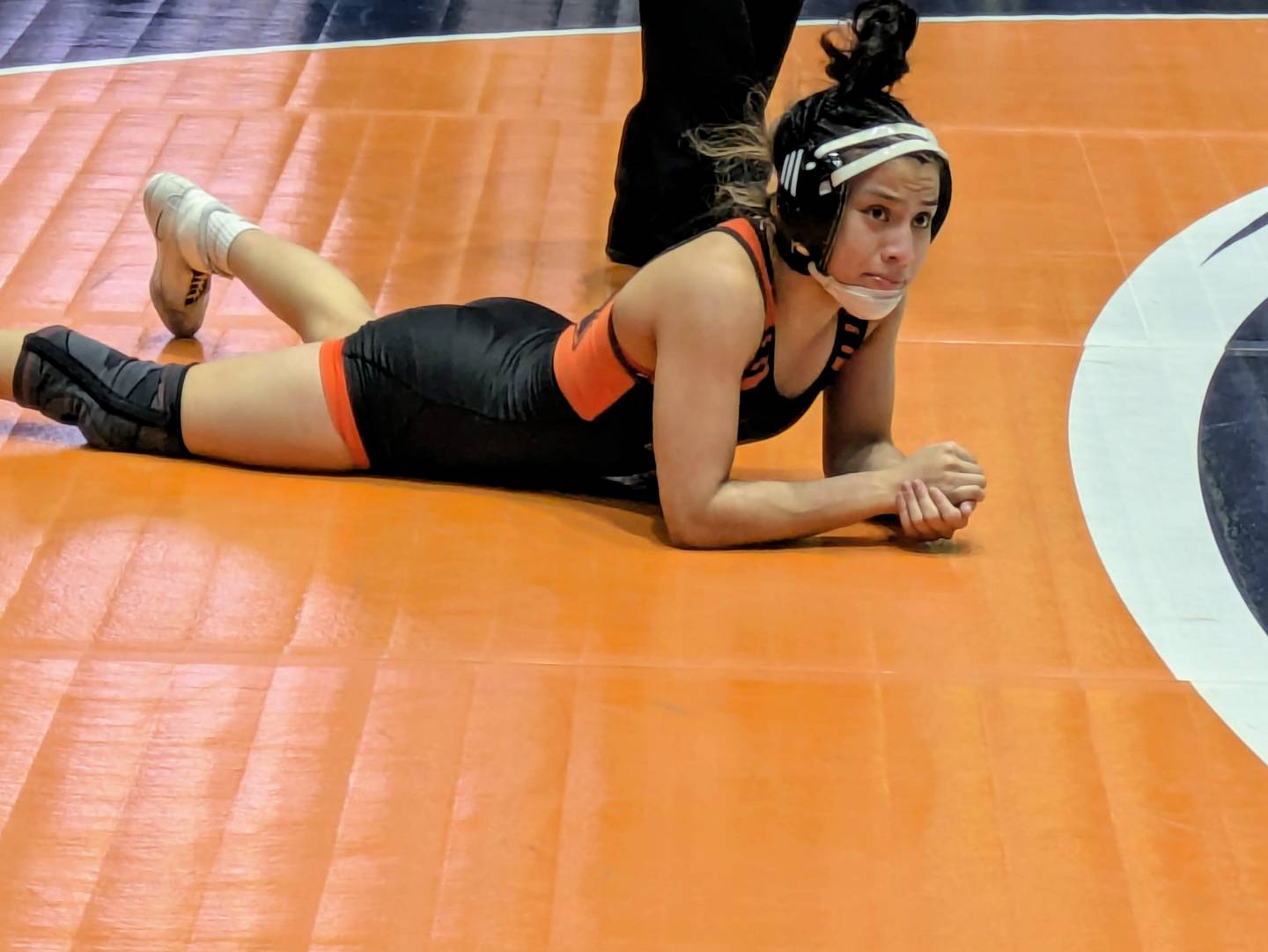Larisza Gomez-Guevara reacts after giving up a two-point nearfall at the third-period buzzer of a 10-8 loss of the third-place match at the IHSA Girls Wrestling State Championship on Saturday in Bloomington.