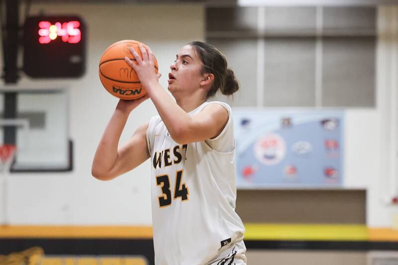 Joliet West’s Natalie Clemente lines up the 3-point shot against Joliet Central on Thursday, Jan 30, 2025 in Joliet.