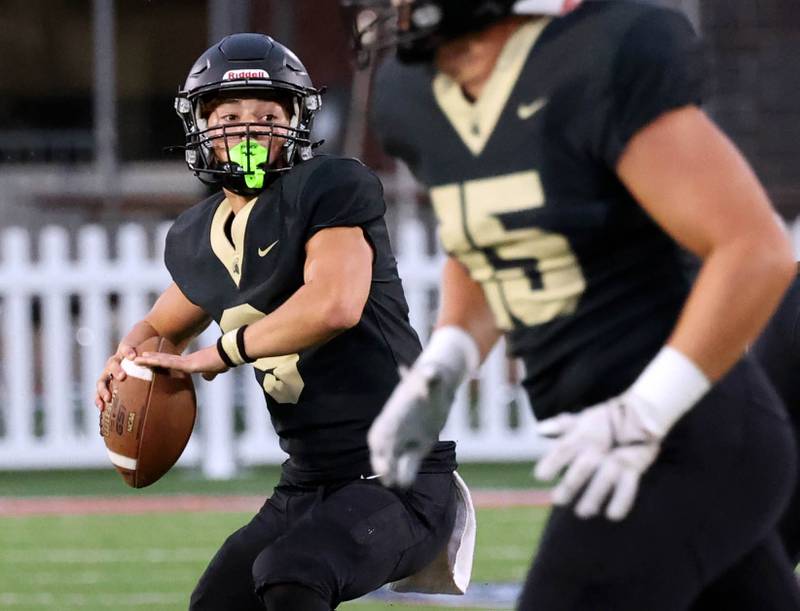 Sycamore's Griffin Larsen throws a touchdown pass after Sycamore's Cooper Bode got behind the DeKalb defense Friday, Aug. 29, 2025, during the FNBO Challenge in Huskie Stadium at Northern Illinois University.