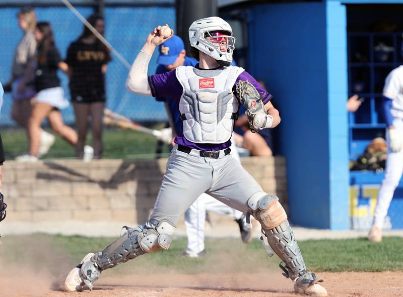 Downers Grove North's catcher Jimmy Janicki throws to second during the boys varsity baseball game between Lyons Township and Downers Grove North high schools in Western Springs on Tuesday, April 11, 2023.