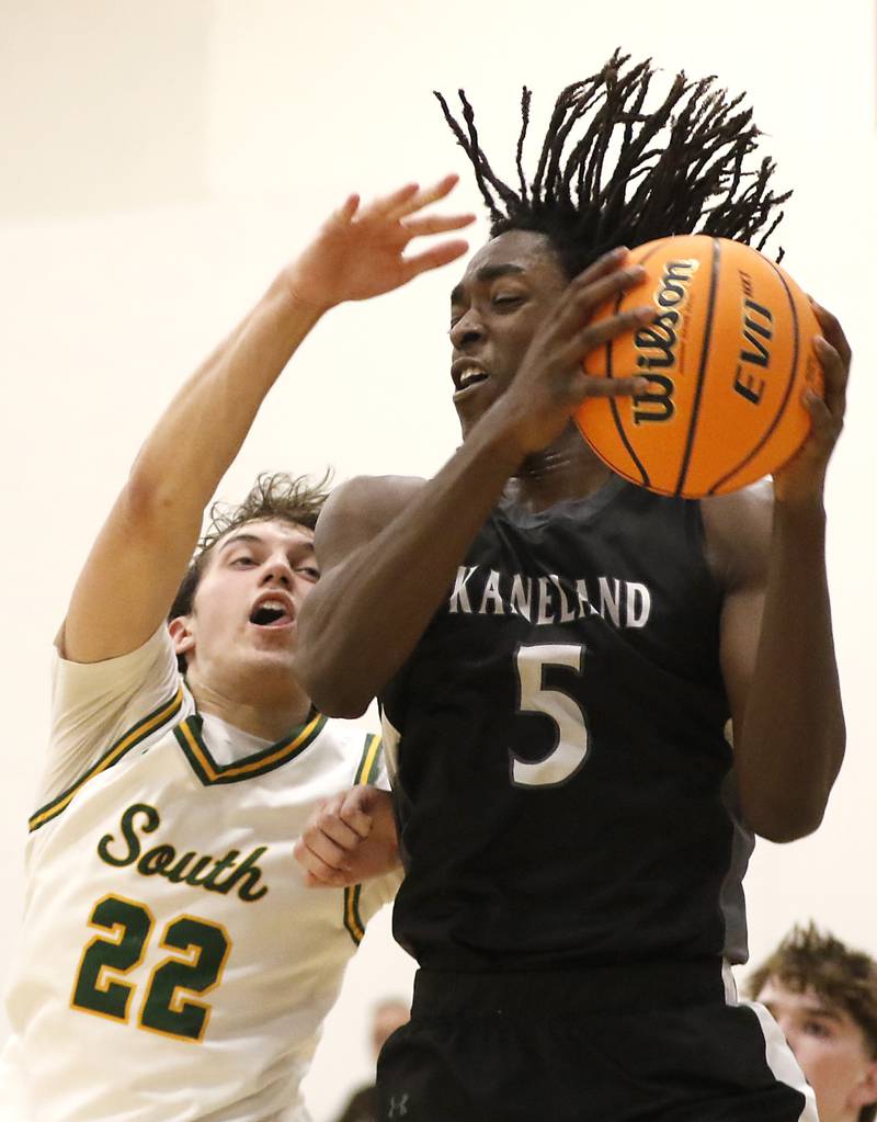 Kaneland's Freddy Hassan grabs a rebound in front of Crystal Lake South's Anthony Santarelli during the IHSA Class 3A Rochelle Sectional championship basketball game on Friday, March 7, 2025, at Rochelle High School.