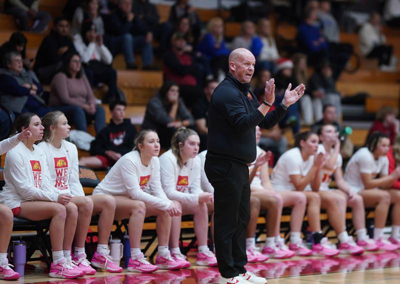 Batavia’s head coach Kevin Jensen cheers on his team during a basketball game against St. Charles North at Batavia High School on Tuesday, Dec 5, 2023.