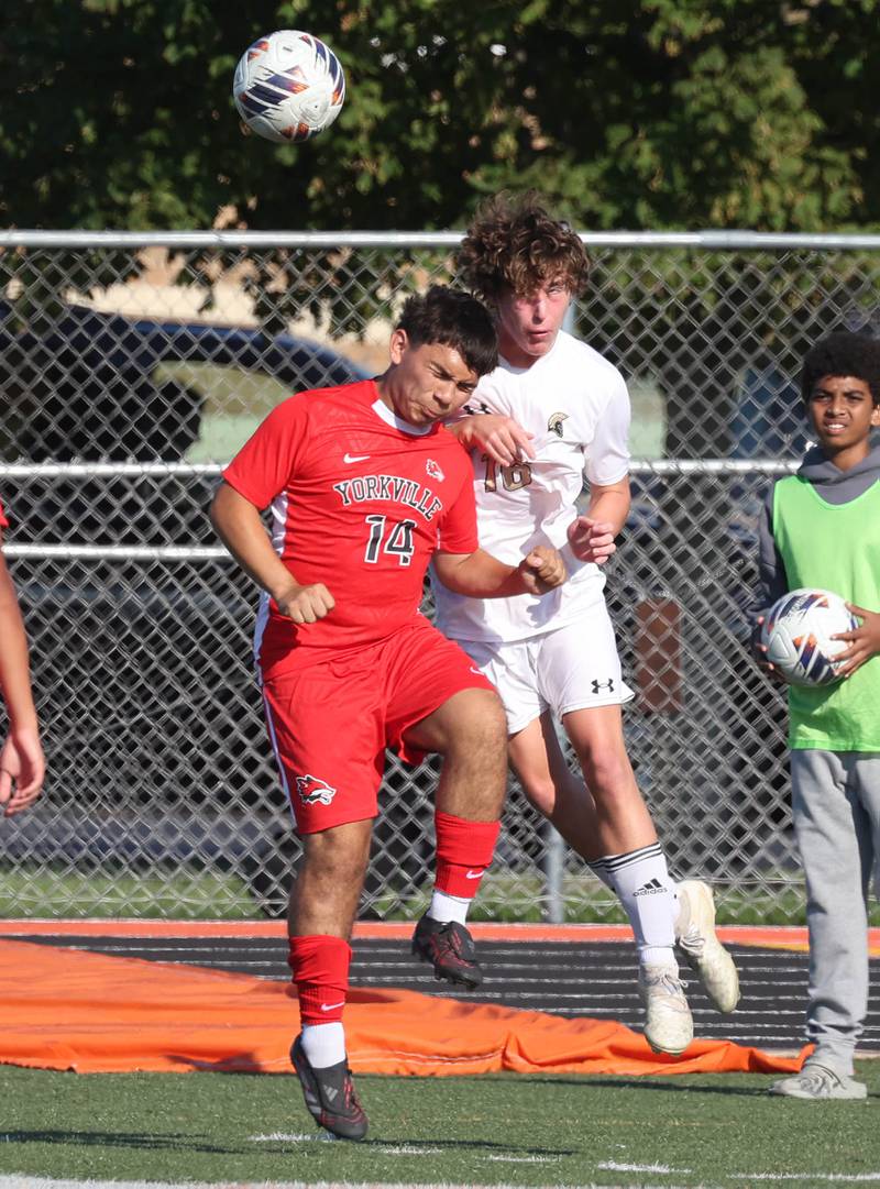 Yorkville's Aidan Dominguez and Sycamore's Maddux McLaughlin go up for a header Thursday, Aug. 28, 2025, during their game in the Barb Cup tournament at DeKalb High School.