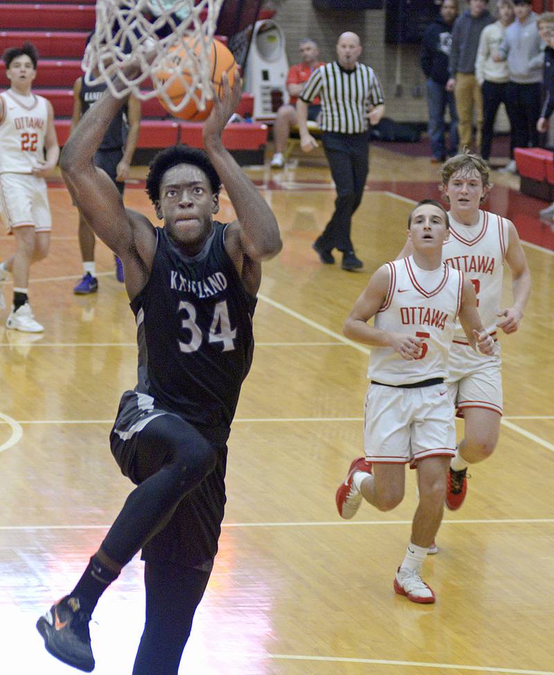 After grabbing a loose ball, Kaneland’s Jeffrey Hassan leaves the Ottawa defense behind for a dunk in the 2nd quarter Tuesday at Ottawa.