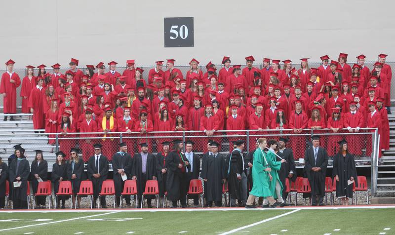 La Salle-Peru Township High School graduates and staff stand during the L-P Class of 2026 commencement ceremony on Thursday, May 14, 2026 at Howard Fellows Stadium.