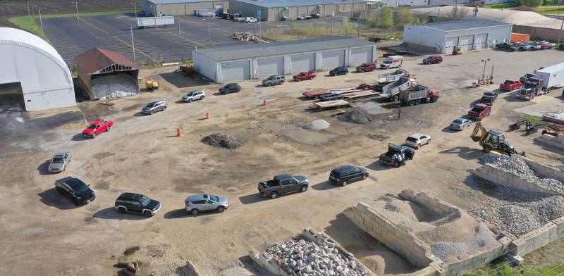 A long line of cars circle to drop off electronics during a free electronics recycling drive on Saturday, April 26, 2025 at the Bureau County Highway Department in Princeton.