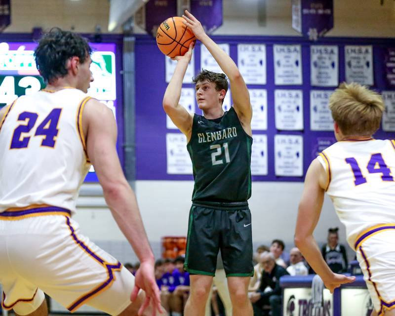 Glenbard West's Bryce Huff (21) shoots a jumper during their basketball game between Glenbard West at Downers Grove North. Jan 24, 2025 in Downers Grove.