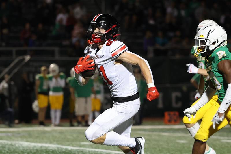 Lincoln-Way Central’s Lucas Andresen breaks away for a touchdown after a catch against Providence on Friday, Sept. 6, 2024 in New Lenox.