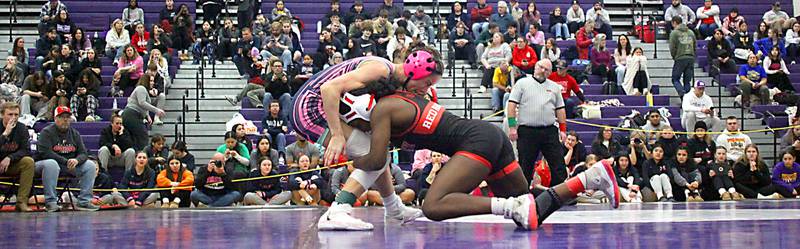 Huntley’s Janiah Slaughter, right, strikes on Woodstock’s Eva Hermansson at 100 pounds in varsity girls IHSA Regional Championship wrestling action on Saturday, February 7, 2026, at Hampshire High School in Hampshire.
