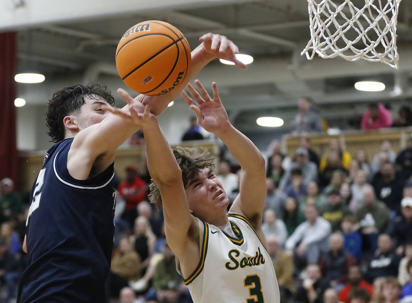 Cary-Grove's Adam Bauer knocks the ball away from Crystal Lake South's Nick Stowasser during the IHSA Class 3A Prairie Ridge Regional championship basketball game on Friday, Feb. 28, 2025, at Prairie Ridge High School in Crystal Lake.