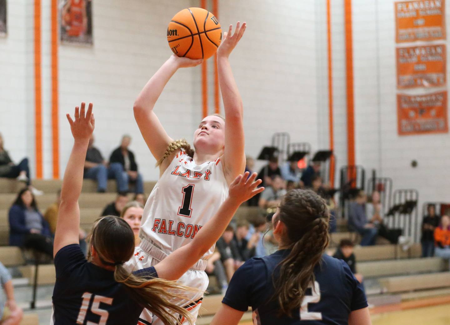 Flanagan-Cornell/Woodland's Ella Derossett shoots a jump shot over Fieldcrest's TeriLynn Timmerman during the Falcon-Irish Thanksgiving Tournament on Monday, Nov. 18, 2024 at Flanagan High School.