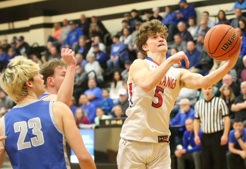 Morrison's Chase Newman eyes the hoop while cutting in the lane past Princeton's Noah LaPorte during the Class 2A Regional final game on Friday, Feb. 23, 2024 at Erie-Prophetstown High School.