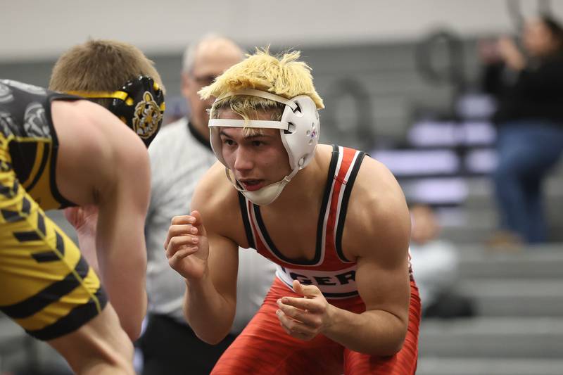 Plainfield North’s Aidan Durell faces off with Joliet West’s Jakob Crandall in the SouthWest Prairie Conference 126 pound championship on Saturday, Jan. 24, 2026 in Minooka.