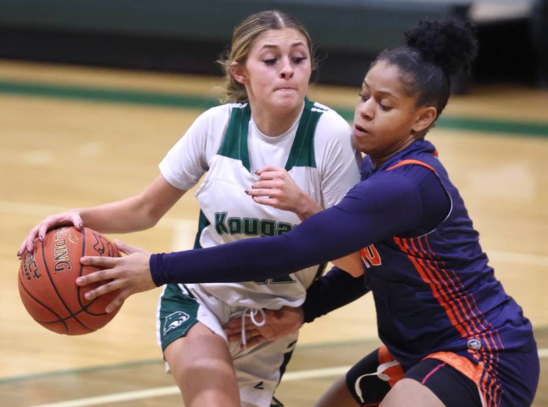 Kishwaukee College's Kira Klapprodt drives against Highland Community College's Alexis Lacy during their game Thursday, Jan. 11, 2024, at Kishwaukee College in Malta.
