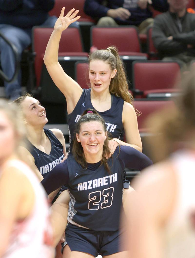 Nazareth's Danielle Scully and Gracie Carstensen celebrate as time ticks down in their win over Morton in the Class 3A state semifinal game Friday, March 4, 2022, in Redbird Arena at Illinois State University in Normal.
