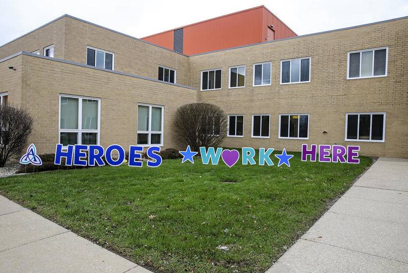 A sign spelling out "Heroes Work Here" can be seen Tuesday, Mar. 31, 2020, at AMITA Health Saint Joseph Medical Center Joliet in Joliet, Ill.