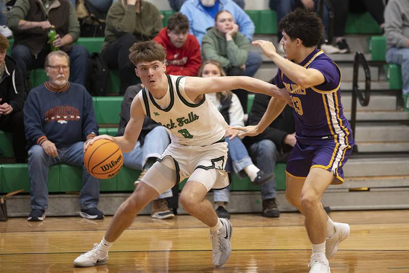 Rock Falls’ Max Burns drives against Mendota’s Oliver Munoz Monday, Dec. 15, 2025.