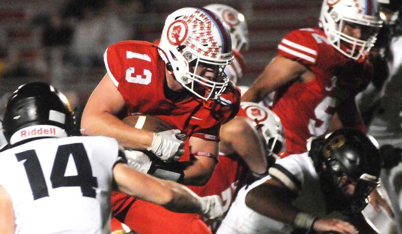 Ottawa's Ethan Poutre (13) punches through the Sycamore defense on Friday, Sept. 26, 2025 at King Field.