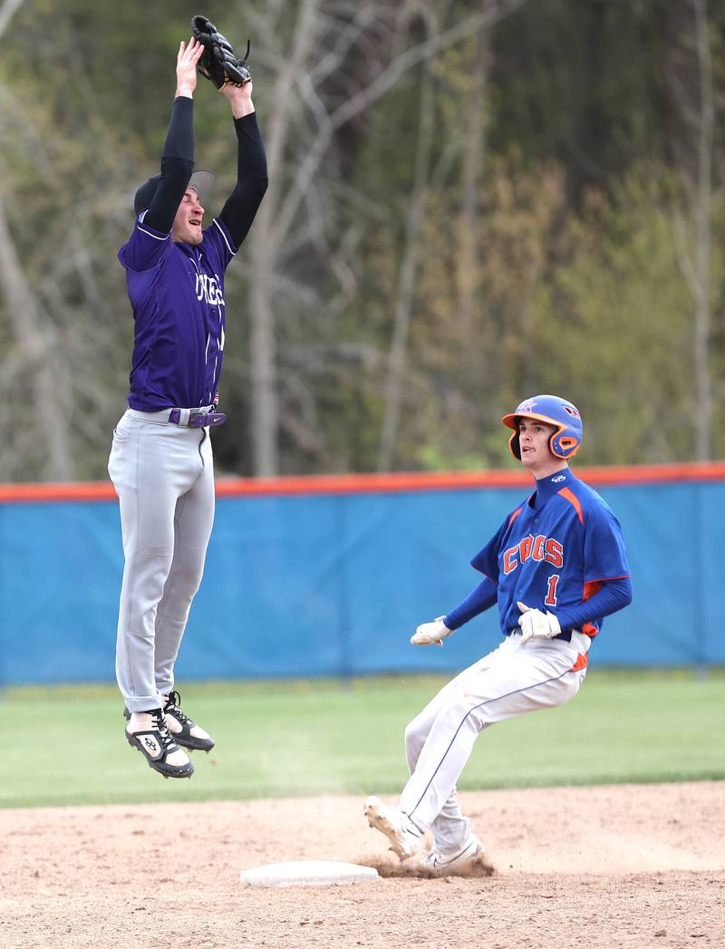 Genoa-Kingston's Connor Grimm steals a base on a high throw but was tagged out after overrunning the base during their game against Rockford Lutheran Tuesday, May 2, 2023, at Genoa-Kingston High School.