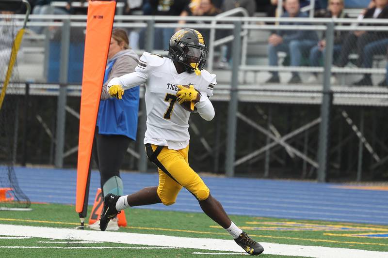 Joliet West’s Jordan Bennett skirts the sideline after a catch against Joliet Central on Saturday, Sept. 28, 2024 in Joliet.