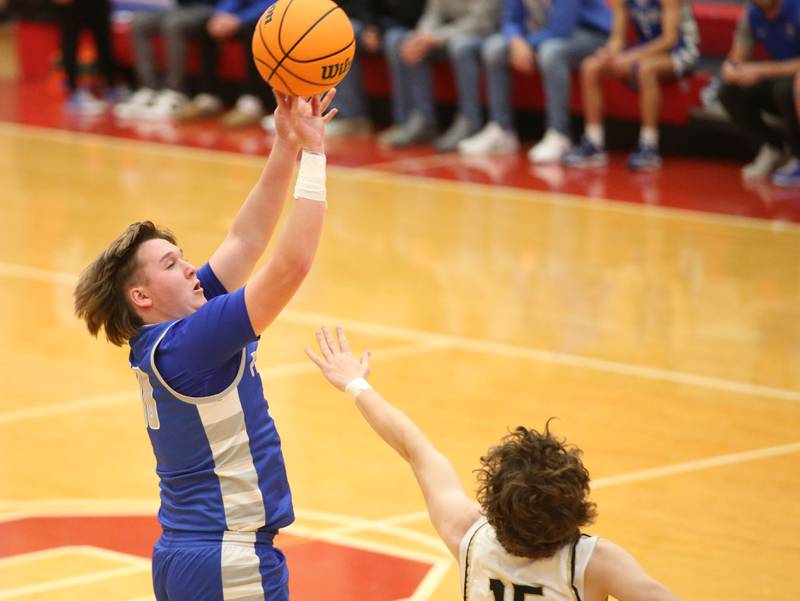 Princeton's Jordan Reinhardt shoots a jump shot over Oak Forest's Kevin Sullivan during the Dean Riley Shootin' The Rock Thanksgiving Tournament on Tuesday, Nov. 26, 2024 in Kingman Gym at Ottawa High School.