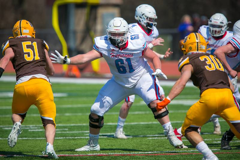 Marian Central Catholic lineman Luke Dalton (61) in the first quarter of the game at Carmel Catholic High School on Saturday, April 3, 2021, in Mundelein, Ill. The Hurricanes won, 34-21.