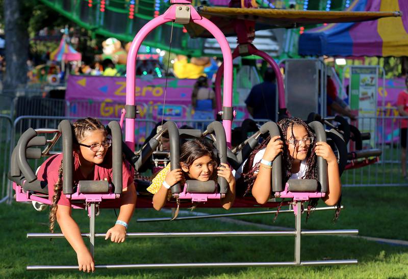Kids enjoy the amusement rides at Montgomery Fest on Friday, Aug. 15, 2025.