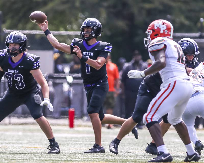 Downers Grove North's Owen Lansu (1) passes during football game between Downers Grove North at Morgan Park Saturday, Aug 30, 2025  in Chicago.