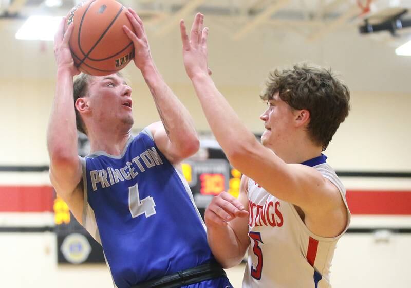 Princeton's Korte Lawson eyes the hoop as Morrison's Chase Newman defends during the Class 2A Regional final game on Friday, Feb. 23, 2024 at Erie-Prophetstown High School.