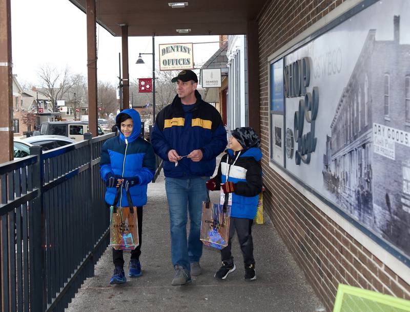 (Left to right) Kaidyn, Kai and Corey Coble participate in the 8th Annual Chocolate Walk for Charity in Oswego on Saturday, Feb. 8, 2025.