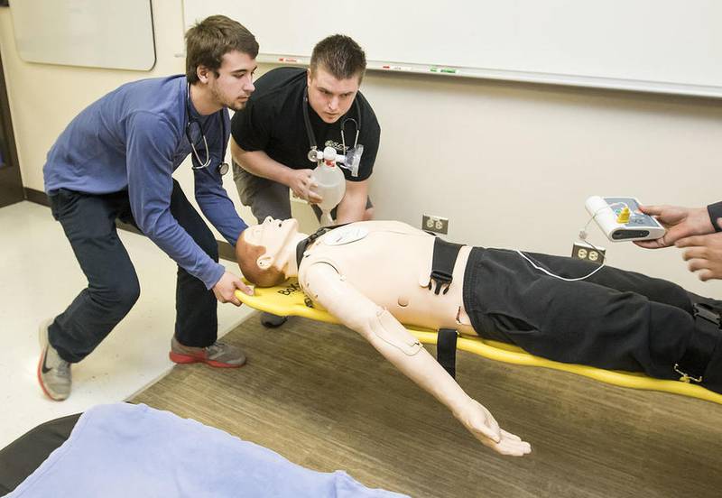 Students Jacob Reid (left) of Crystal Lake and James Harrison of Huntley transport a patient during a simulation lab at McHenry County College in Crystal Lake Saturday, March 25, 2017.
