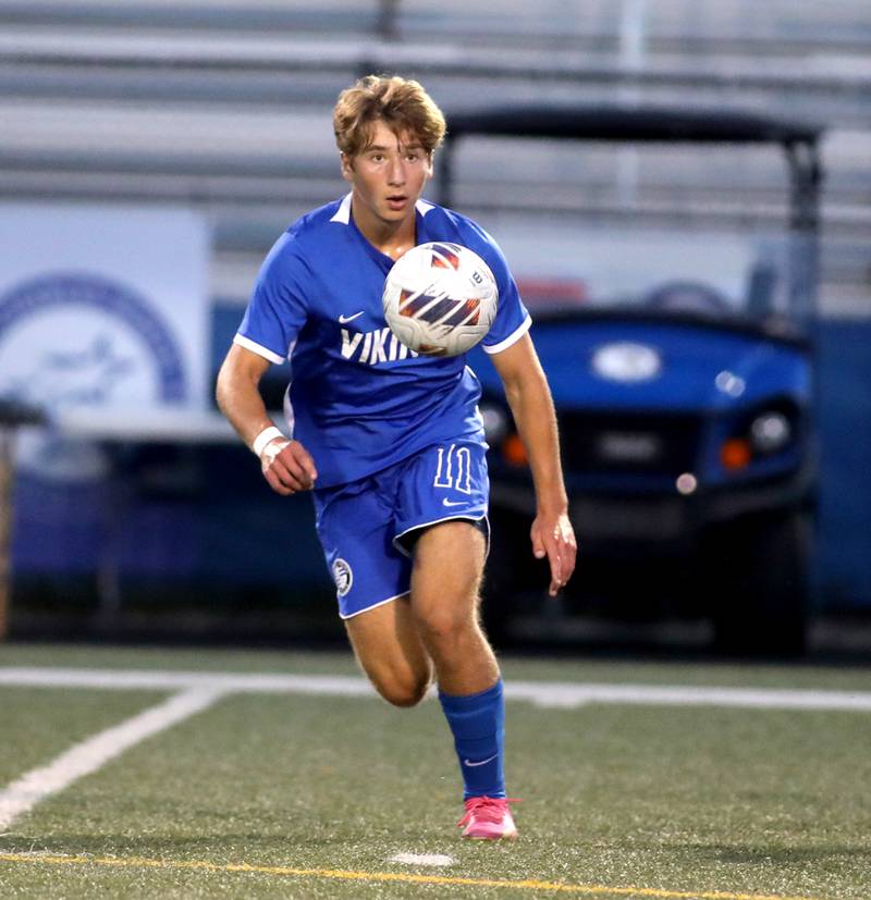 Geneva’s Peyton Friedman goes after the ball during a game against St. Charles East at Geneva on Tuesday, Oct. 3, 2023.
