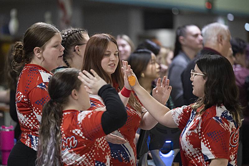 The Oregon team celebrates a good frame Friday, Feb. 7, 2025, in the girls bowling regionals at Plum Hollow in Dixon.
