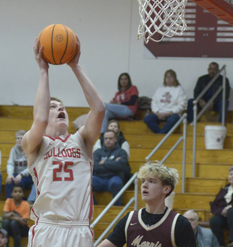 Streator’s Joseph Hoekstra gets past Morris’s Haydon MacDonald to score in the 1st quarter Wednesday at Streator.