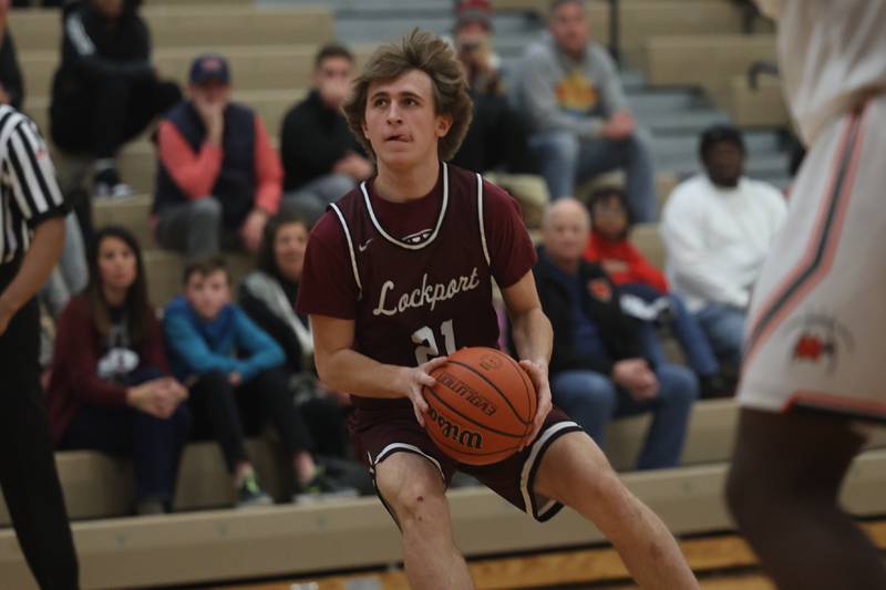 Lockport’s Bryce Hunter lines up an outside shot against Minooka.