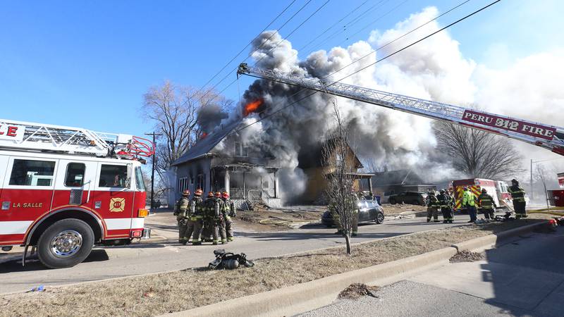 Photos: La Salle firefighters battle two-story house fire on Bucklin Street