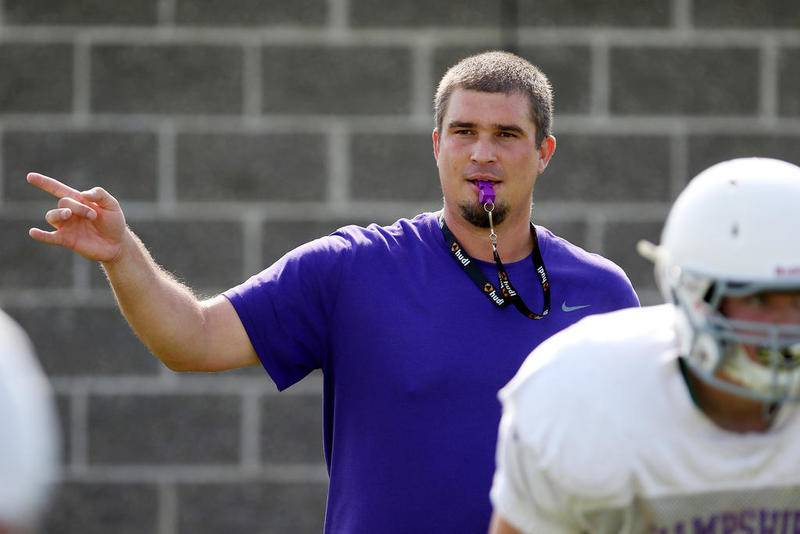 Hampshire coach Jake Brosman calls out the direction for a blocking drill during practice Tuesday in Hampshire.