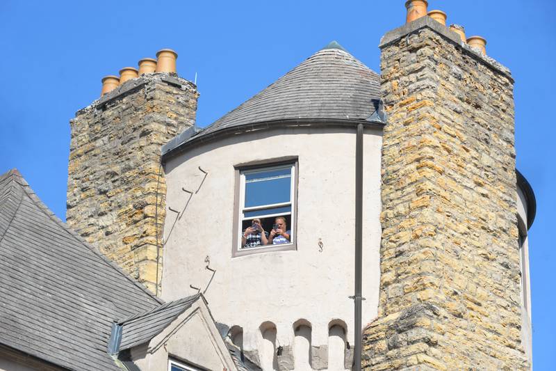 Visitors to the Olde English Fair at Stronghold Camp & Retreat Center take photos from the castle's tower on Saturday, Oct. 5, 2024, during the Autumn on Parade festival in Oregon.