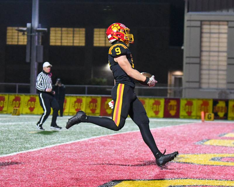 Batavia's Nick Jansey (9) runs the ball in for a touchdown after a fumble recovery while taking on Hoffman Estate during the first round of playoffs on Friday Oct. 31, 2025, held at Batavia High School.