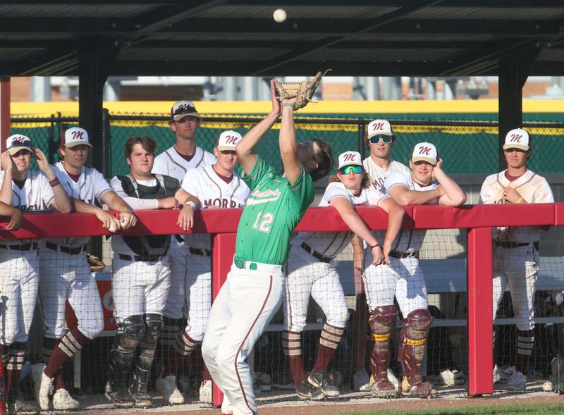 L-P's Brendan Boudreau makes a catch near the Morris dugout during the Class 3A Regional semifinal game at Huby Sarver Field in La Salle.