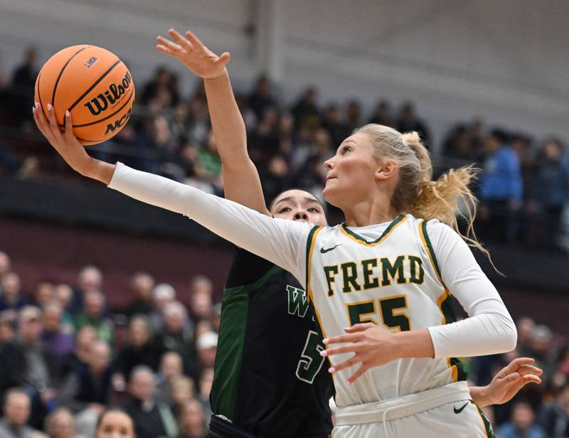Fremd’s Greta Thompson gets fouled by Glenbard West's Lauren Escalante during the Hersey Class 4A supersectional at Forest View Education Center on Monday, March 3, 2025 in Arlington Heights.